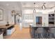 Open-concept kitchen featuring stainless steel appliances, granite countertops, and stylish island seating at 2940 W Village Dr # 60, Suwanee, GA 30024
