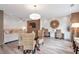 Bright living room boasts modern lighting, wood accent wall with TV, and stylish wicker furniture at 2940 W Village Dr # 60, Suwanee, GA 30024