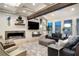 Spacious living room with a modern fireplace, large windows with plantation shutters and comfortable sofas at 2940 W Village Dr # 60, Suwanee, GA 30024