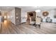 Spacious living area with modern lighting, wood accent wall, and stylish wicker seating at 2940 W Village Dr # 60, Suwanee, GA 30024