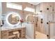 Spacious bathroom featuring an LED mirror over a vanity and a large glass-enclosed shower at 2940 W Village Dr # 60, Suwanee, GA 30024