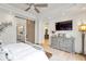Bright main bedroom with hardwood floors, soft color palette, and view into main bathroom at 2940 W Village Dr # 60, Suwanee, GA 30024