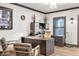 A stylish home office featuring a modern desk, built-in shelving, and contemporary decor at 2940 W Village Dr # 60, Suwanee, GA 30024