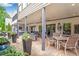 Expansive outdoor patio with seating, dining, hot tub, and lush landscaping, ideal for entertaining at 2940 W Village Dr # 60, Suwanee, GA 30024