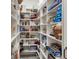 Walk-in pantry with ample shelving for organized storage solutions and tiled floors at 2940 W Village Dr # 60, Suwanee, GA 30024