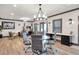 Spacious recreation room featuring a table, seating, an office area, and natural light at 2940 W Village Dr # 60, Suwanee, GA 30024