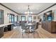 Large recreation room with seating, dining table, and media center for entertainment at 2940 W Village Dr # 60, Suwanee, GA 30024