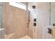 Close up of glass enclosed shower with large format tile surround and dual shower heads at 2940 W Village Dr # 60, Suwanee, GA 30024