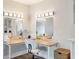 Brightly lit vanity area with mirrors, a comfortable chair, and ample counter space at 2940 W Village Dr # 60, Suwanee, GA 30024