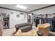 Spacious walk-in closet with ample storage, custom shelving, seating, and closet organizers at 2940 W Village Dr # 60, Suwanee, GA 30024
