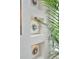 Modern built-in wall niches with art and a tropical plant near a large window for bright natural light at 2940 W Village Dr # 60, Suwanee, GA 30024