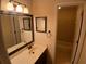 Cozy bathroom features a vanity with a decorative mirror, and a shower/tub combo at 3011 Canyon Point Cir, Roswell, GA 30076