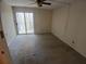 Bedroom featuring carpet floors, a ceiling fan, and sliding glass doors leading to a private balcony at 3011 Canyon Point Cir, Roswell, GA 30076