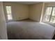 Spacious bedroom featuring neutral carpet and natural light streaming through large windows at 3011 Canyon Point Cir, Roswell, GA 30076