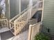 Exterior stairs and walkway featuring wood railings, providing access to upper levels at 3011 Canyon Point Cir, Roswell, GA 30076