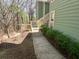 Exterior shot of the building with a concrete walkway that leads to the entrance of the building at 3011 Canyon Point Cir, Roswell, GA 30076