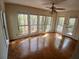 Bright sunroom with many windows and hardwood floors, perfect for enjoying nature at 3011 Canyon Point Cir, Roswell, GA 30076
