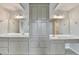 Bathroom featuring double sinks, plentiful cabinetry, and walk in closet at 10460 Cranchester Way, Alpharetta, GA 30022