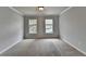 Bedroom featuring two windows allowing for natural light at 10460 Cranchester Way, Alpharetta, GA 30022