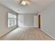 Bedroom with carpet, natural light from windows, and closet for optimal living at 10460 Cranchester Way, Alpharetta, GA 30022