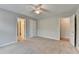 Neutral bedroom with carpet, an ensuite bathroom, and a closet for optimal living at 10460 Cranchester Way, Alpharetta, GA 30022