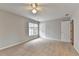 Bedroom with carpet, natural light from windows, and closet for optimal living at 10460 Cranchester Way, Alpharetta, GA 30022