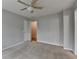 Comfortable bedroom with neutral paint, carpet, ceiling fan, and a closet at 10460 Cranchester Way, Alpharetta, GA 30022