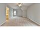 Bedroom with carpet, an ensuite bathroom, and a window for optimal living at 10460 Cranchester Way, Alpharetta, GA 30022