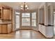 Dining area with tile backsplash, view into backyard, and hardwood floors at 10460 Cranchester Way, Alpharetta, GA 30022