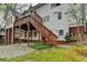 A split level deck featuring wood stairs and access to a fully fenced yard at 10460 Cranchester Way, Alpharetta, GA 30022