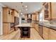 Bright kitchen featuring stainless steel appliances, island with cooktop and barstool seating at 10460 Cranchester Way, Alpharetta, GA 30022