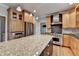 Gourmet kitchen featuring stainless steel appliances, granite countertops, island and designer cabinetry at 10460 Cranchester Way, Alpharetta, GA 30022