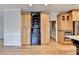Kitchen with wood floors, wood cabinets, and custom shelving at 10460 Cranchester Way, Alpharetta, GA 30022