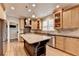 Spacious kitchen featuring stainless steel appliances, a large island, and custom cabinetry at 10460 Cranchester Way, Alpharetta, GA 30022
