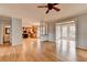 Open-concept living room showcasing a kitchen and sunroom, perfect for modern living at 10460 Cranchester Way, Alpharetta, GA 30022