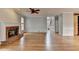 Open living area featuring a fireplace and staircase, blending comfort and functionality at 10460 Cranchester Way, Alpharetta, GA 30022