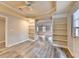 Bright living room with built-in bookshelves, gray flooring, and stylish trim at 10460 Cranchester Way, Alpharetta, GA 30022
