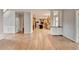 Spacious living room showcasing access to the kitchen and stairs, offering seamless transitions at 10460 Cranchester Way, Alpharetta, GA 30022