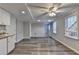 The living room features light gray walls, hardwood floors, and a kitchenette with granite counters at 10460 Cranchester Way, Alpharetta, GA 30022