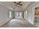 Large main bedroom with ceiling fan, carpet, lots of natural light and ensuite access at 10460 Cranchester Way, Alpharetta, GA 30022