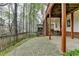 Spacious outdoor stone patio area perfect for entertaining guests with access to covered deck at 10460 Cranchester Way, Alpharetta, GA 30022