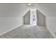 Bright attic space, featuring carpeting, natural light and plenty of room for storage at 1924 Wilkenson Xing, Marietta, GA 30066