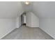 Cozy attic space with neutral carpet and paint, offering ample opportunity for custom design at 1924 Wilkenson Xing, Marietta, GA 30066
