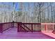 Spacious outdoor back deck area featuring dark wood, overlooking a wooded lot at 1924 Wilkenson Xing, Marietta, GA 30066