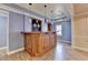 Wet bar with modern pendant lighting and wooden cabinetry against light blue walls, perfect for gatherings at 1924 Wilkenson Xing, Marietta, GA 30066
