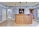 Basement wet bar with wooden cabinetry, pendant lighting, and modern finishes at 1924 Wilkenson Xing, Marietta, GA 30066