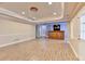 Finished basement with a wet bar, recessed lighting, and light wood floors, ideal for relaxation at 1924 Wilkenson Xing, Marietta, GA 30066