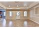 Large basement area with recessed lighting, light-colored walls, and two windows for ample sunlight at 1924 Wilkenson Xing, Marietta, GA 30066