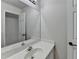 Clean bathroom with a large mirror, and a neutral color scheme, making it move-in ready at 1924 Wilkenson Xing, Marietta, GA 30066