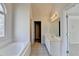 Bright bathroom featuring a large tub, vanity, and a window providing natural light at 1924 Wilkenson Xing, Marietta, GA 30066